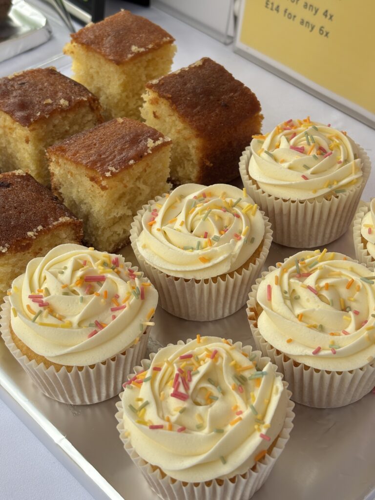 Vanilla Cupcakes with Buttercream Frosting and Colorful Sprinkles